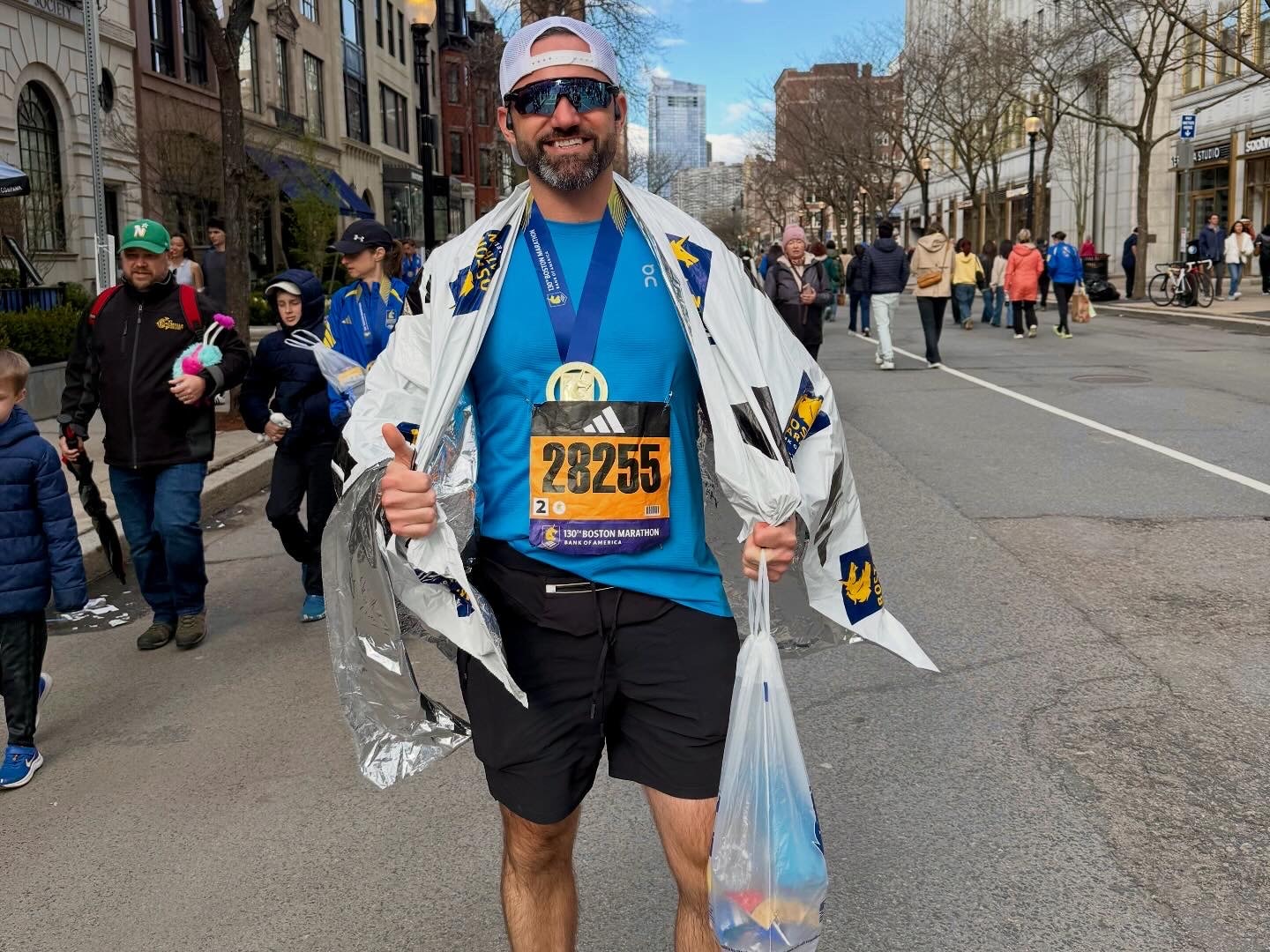 Mike crossing the Boston Marathon finish line